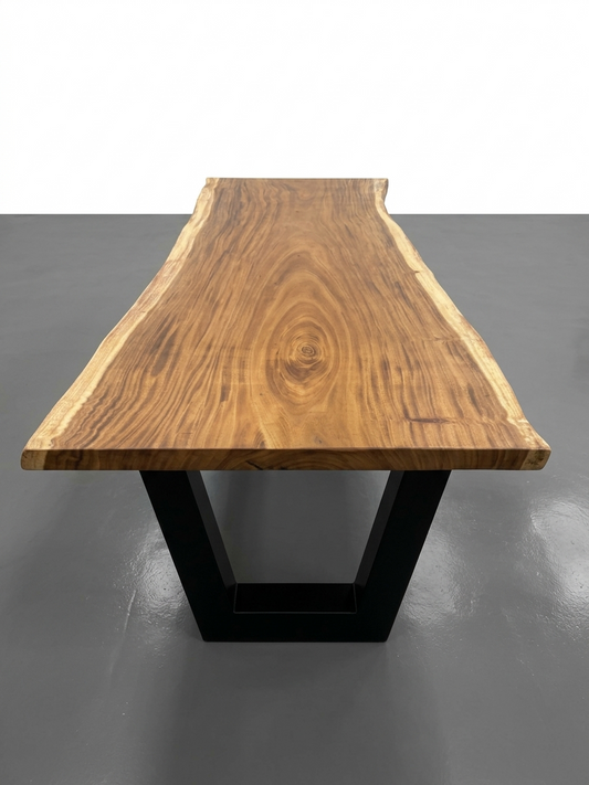 Slab No. 19: 8 ft 4 in single-slab Saman (monkeypod) live-edge dining table on a black steel base, on a white background. This photo identifies the listing; warehouse photographs of the slab follow.