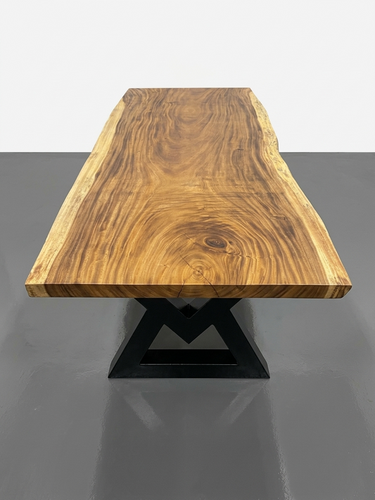 Slab No. 17: 8 ft 4 in single-slab Saman (monkeypod) live-edge dining table on a black steel base, on a white background. This photo identifies the listing; warehouse photographs of the slab follow.
