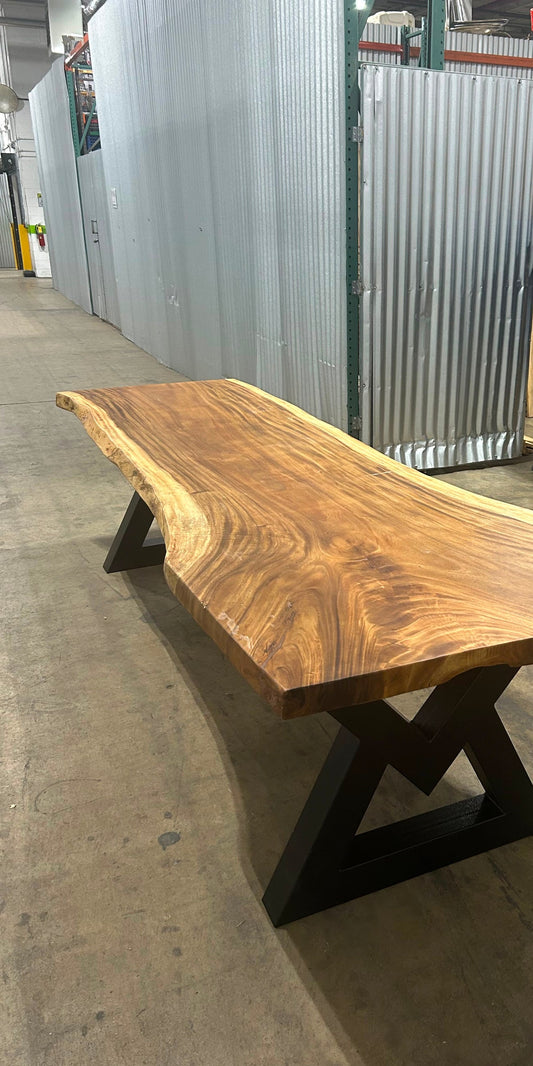 Single-slab Saman monkeypod live-edge table on a black steel base — Platinum Luxury Teak, in stock in Chicago