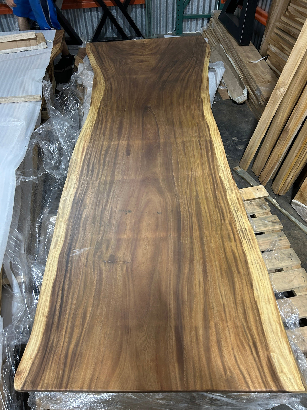 Slab No. 03, first face - the actual 10 ft single-slab Saman monkeypod top, matte lacquer finish, photographed in our Lincolnwood IL warehouse
