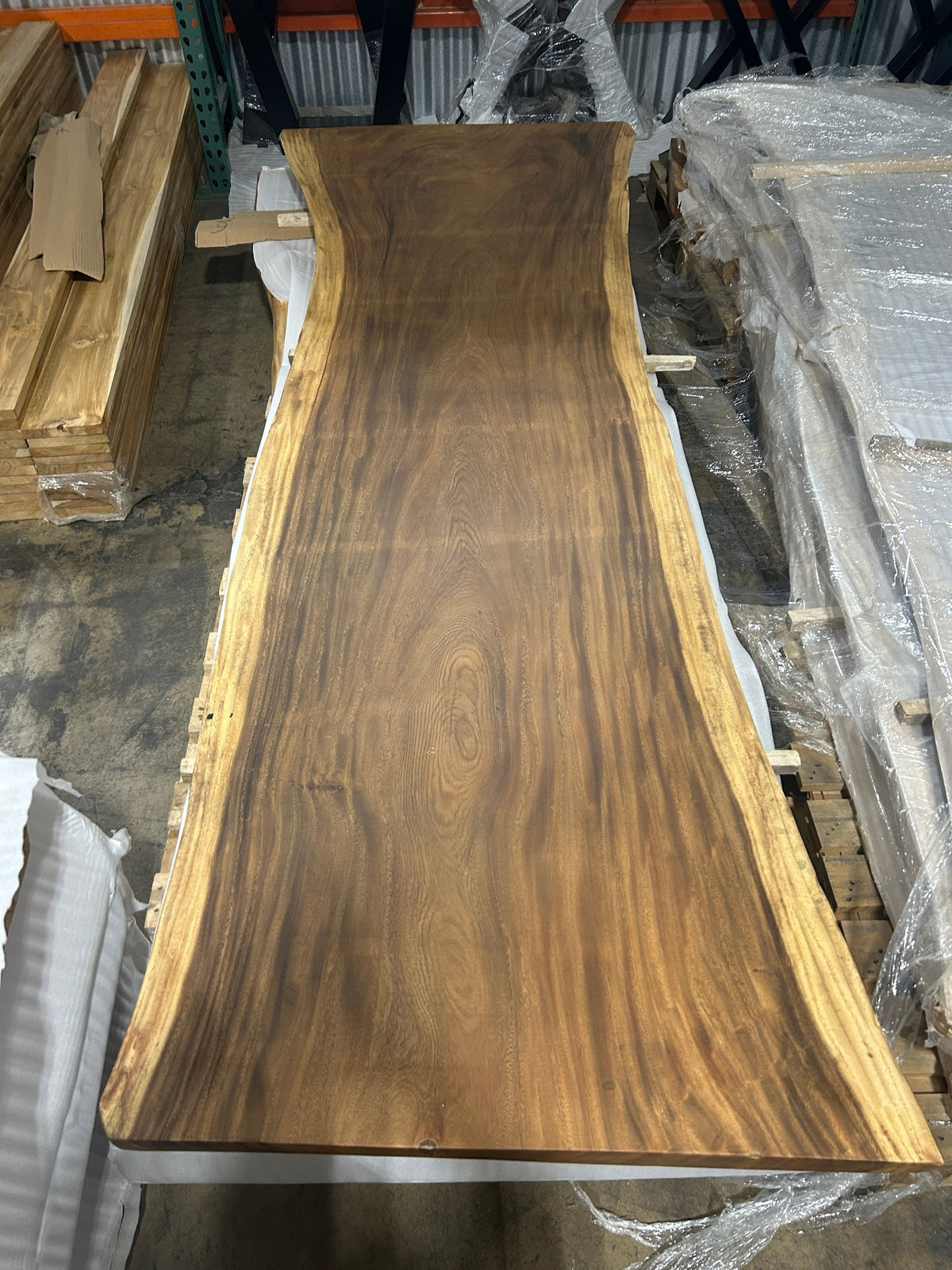 Slab No. 05, first face - the actual 10 ft single-slab Saman monkeypod top, matte lacquer finish, photographed in our Lincolnwood IL warehouse