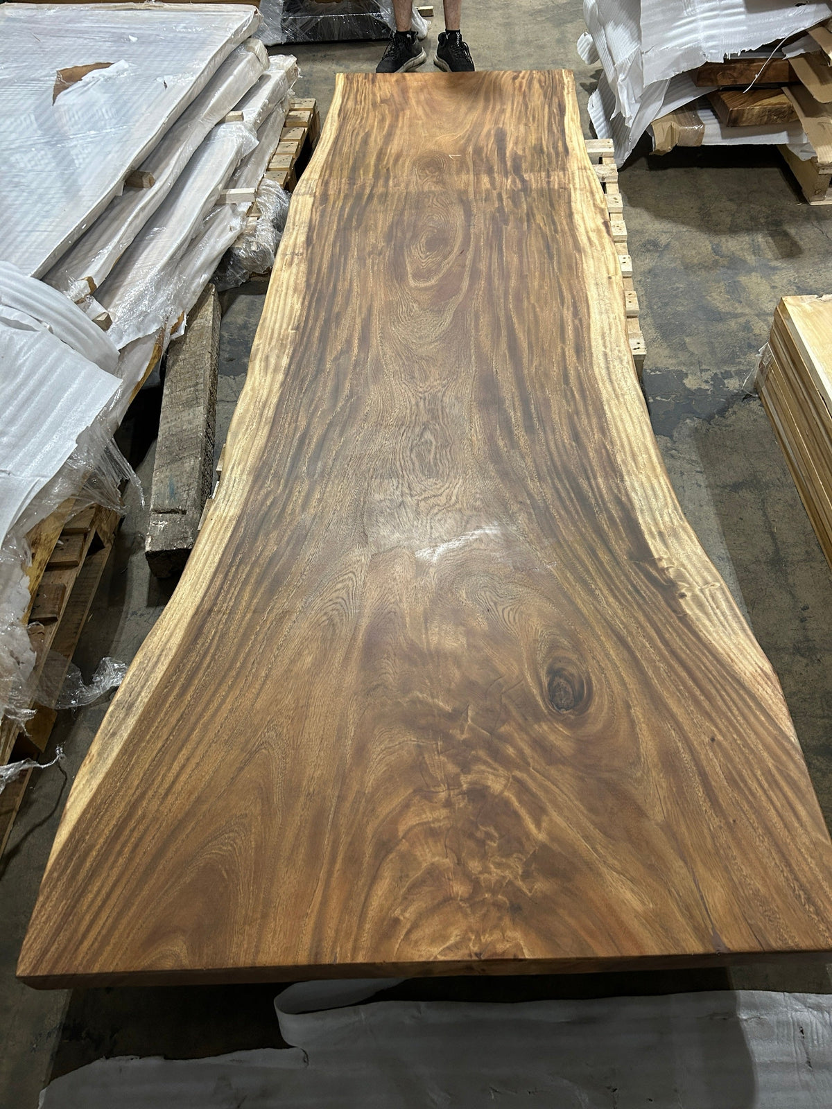 Slab No. 06 from the wide end - the actual 10 ft single-slab Saman monkeypod top, matte lacquer finish, photographed in our Lincolnwood IL warehouse