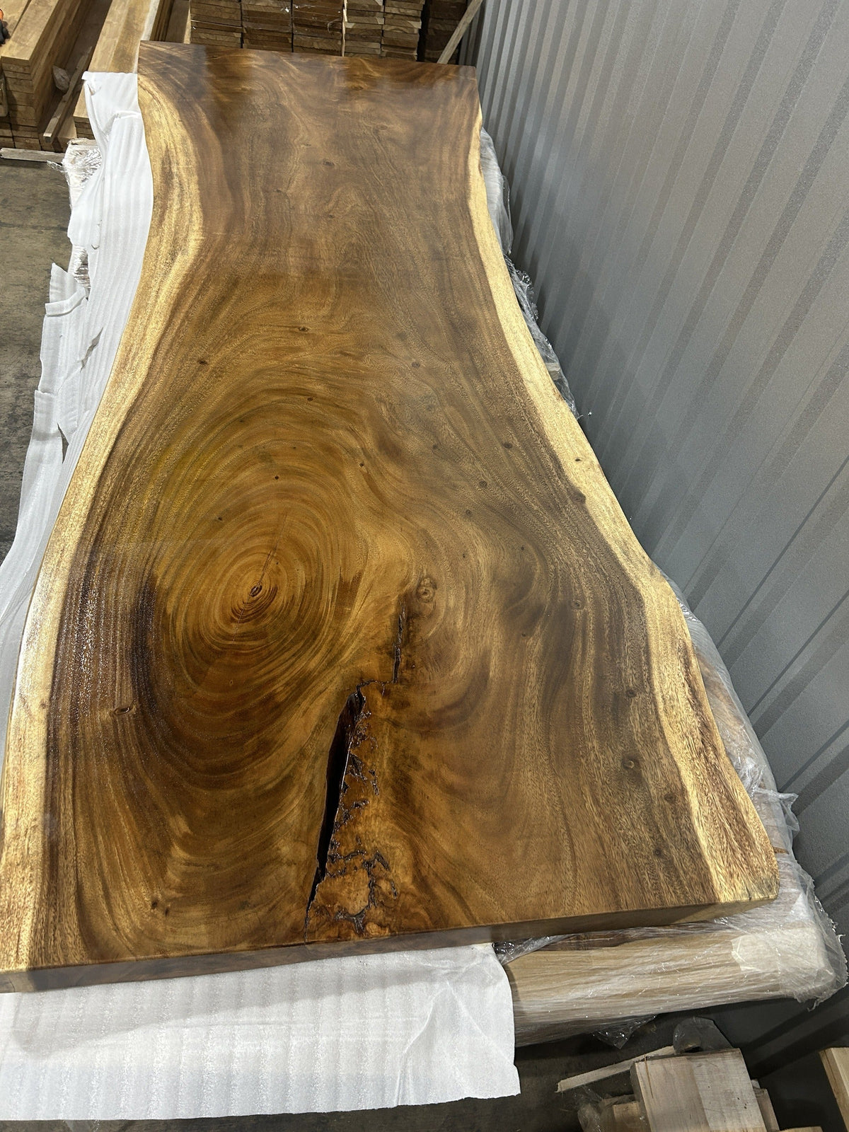 Representative single-slab Saman monkeypod live-edge top from our current inventory — Platinum Luxury Teak, Lincolnwood IL