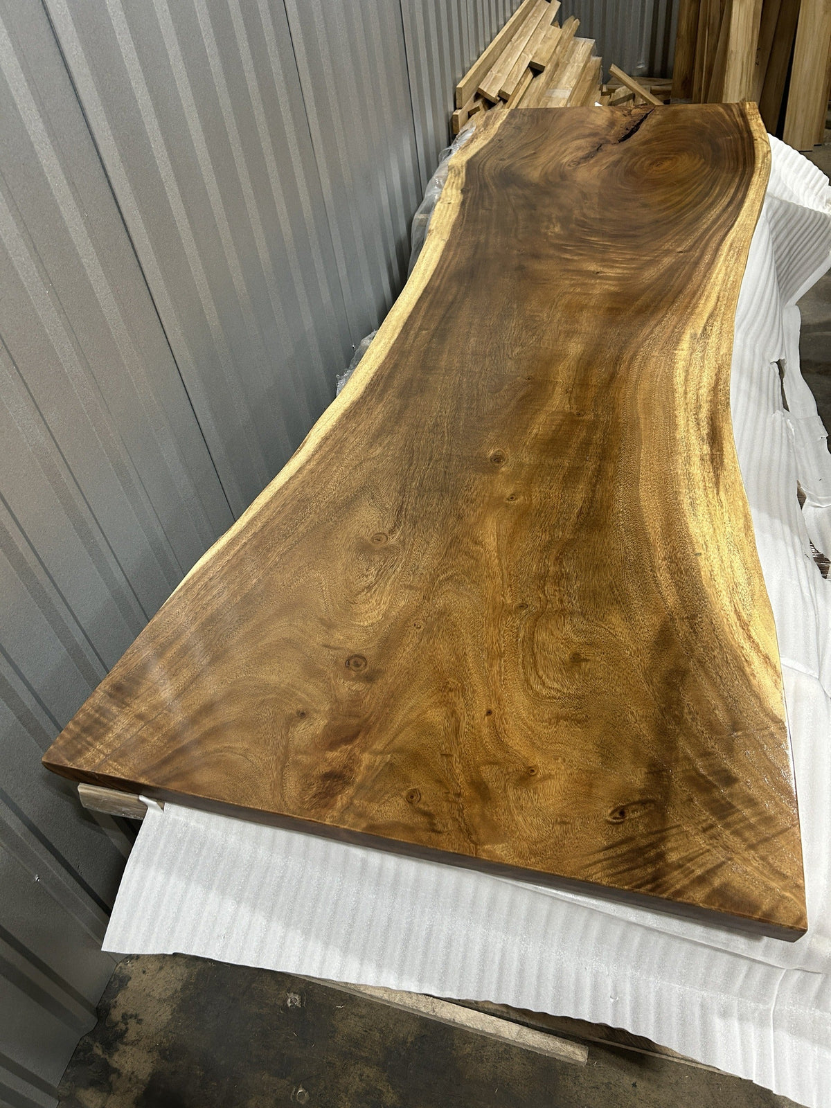 Representative single-slab Saman monkeypod live-edge top showing the 2.5 in thickness — Platinum Luxury Teak, Lincolnwood IL